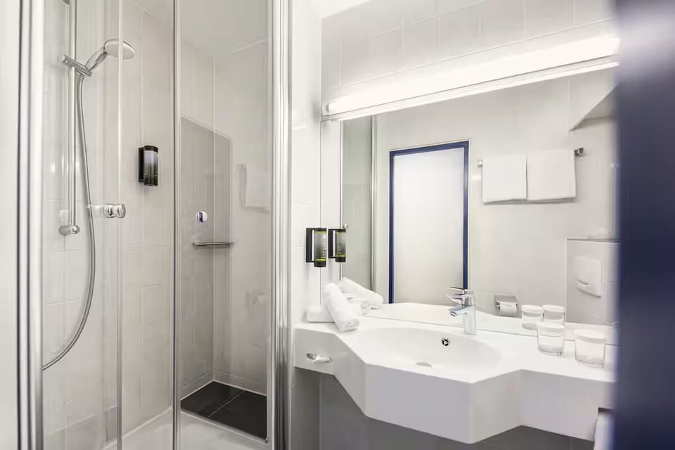 Step into the clean glass shower for an easy reset.