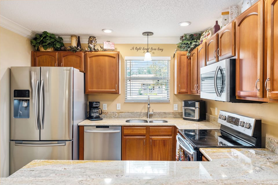 Stainless Steel Appliances Including a Fridge with Water/Ice Dispenser 