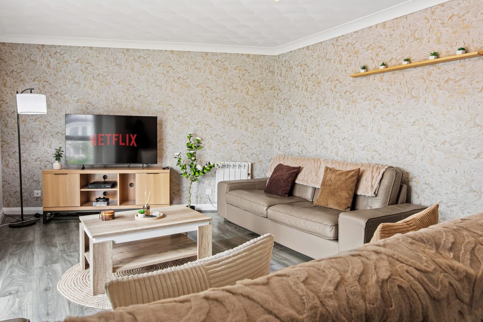 Cozy lounge with Netflix, comfy seating, and warm modern touches