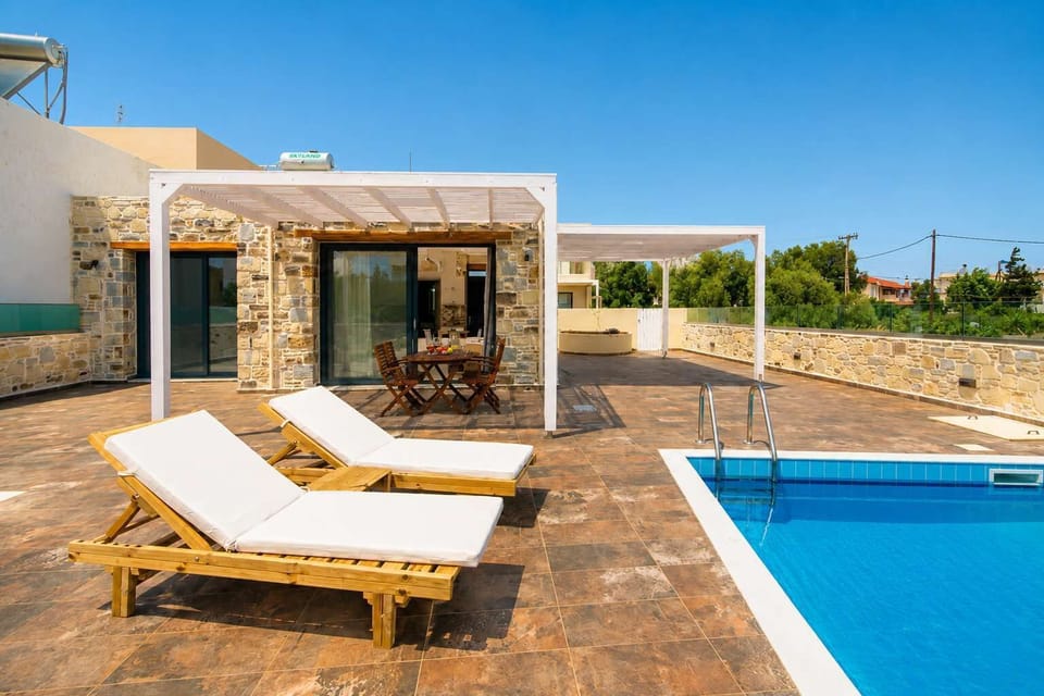 Relax by your private pool with comfortable sun loungers