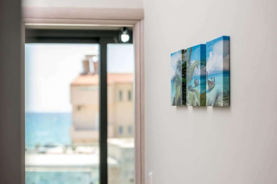 Decorative details of the villa with the seaview in the backround.
