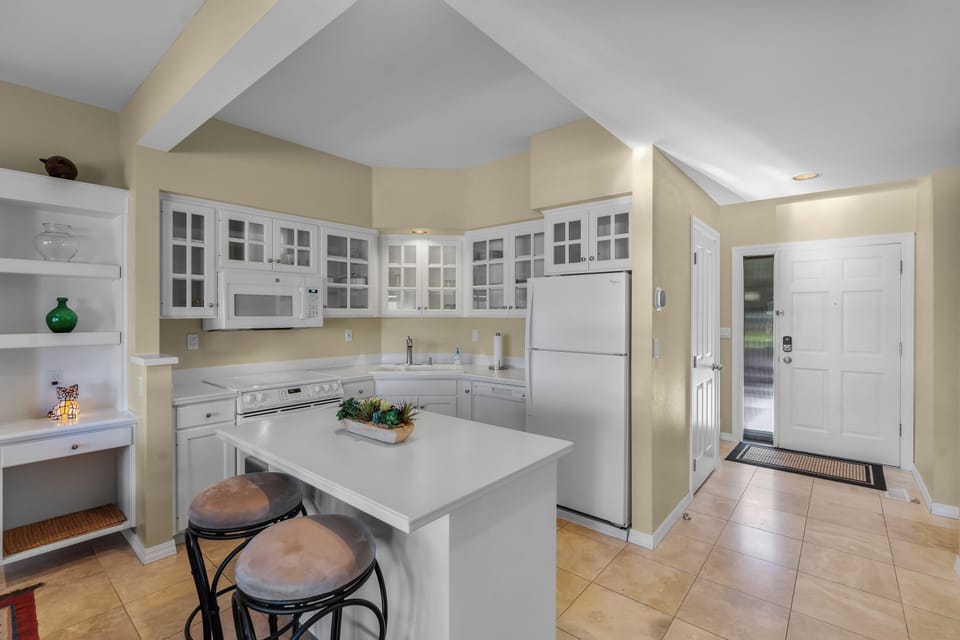 Picture yourself preparing your favorite meal in this bright, fully equipped kitchen. Enjoy the open layout, plenty of counter space, and modern appliances that make cooking feel effortless during your stay.