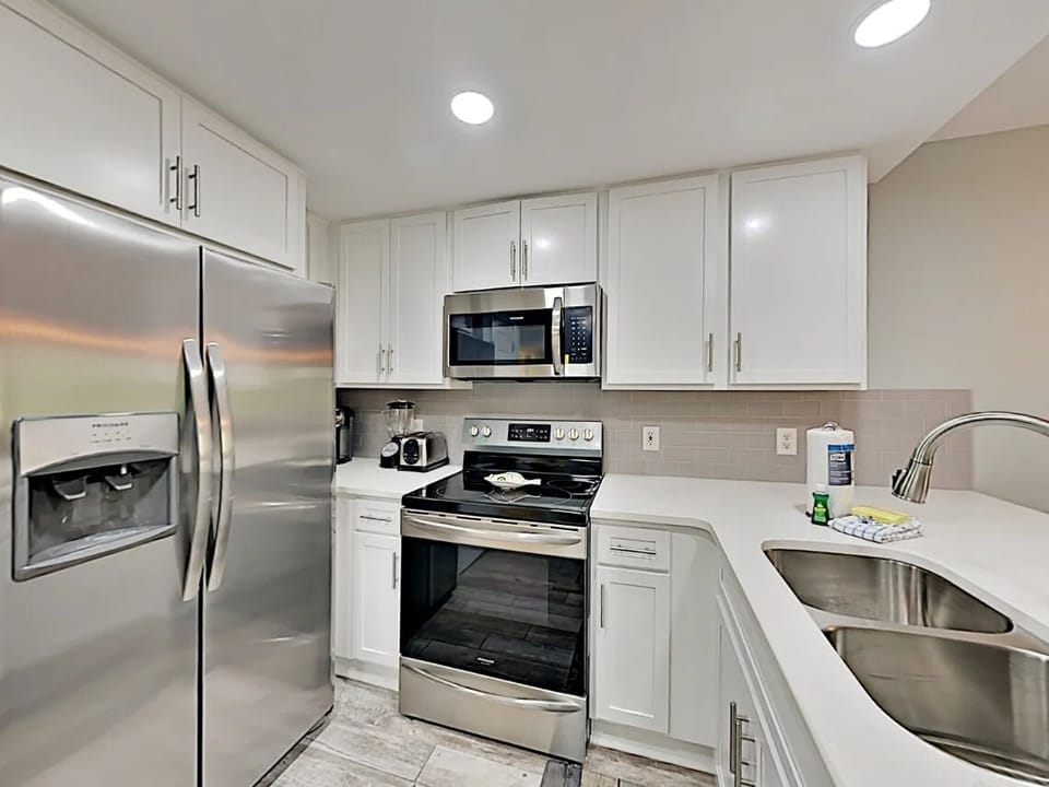 Fully equipped kitchen with stainless steel appliances