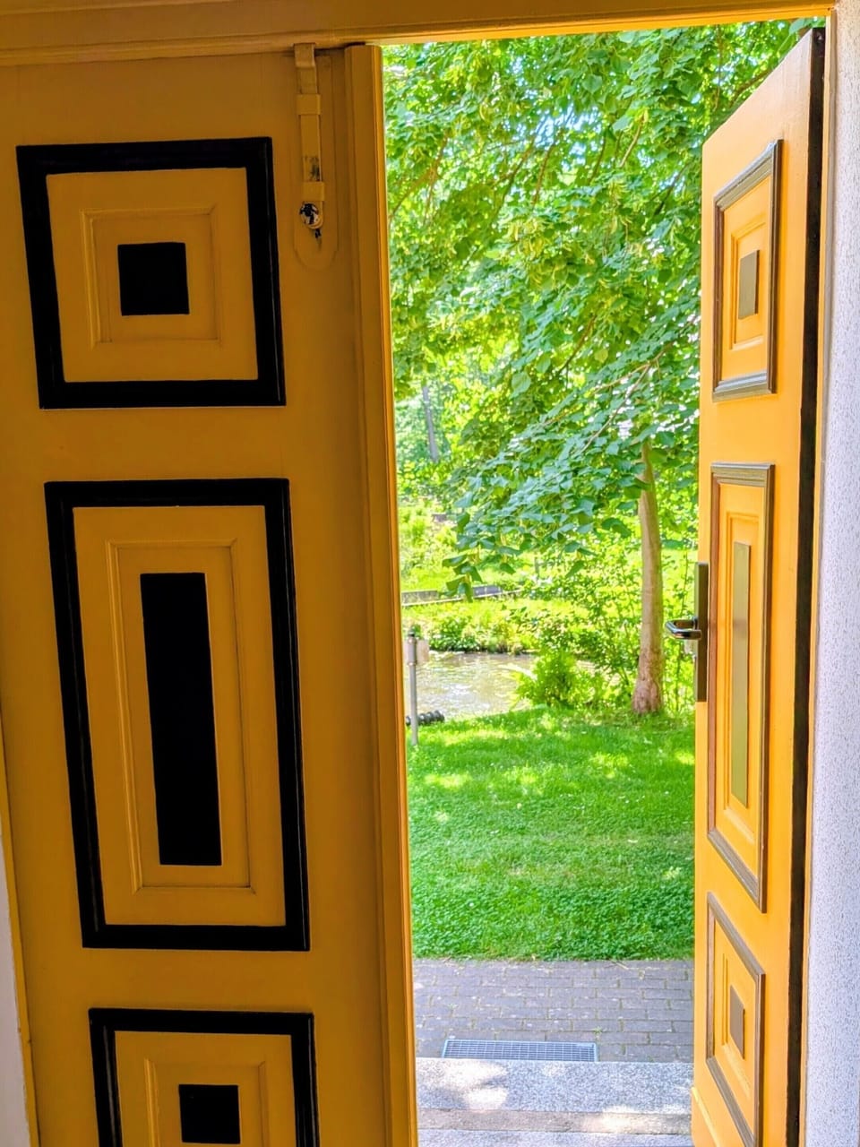 Entrance door of the Old Leiper Village School with a view of the outdoor area