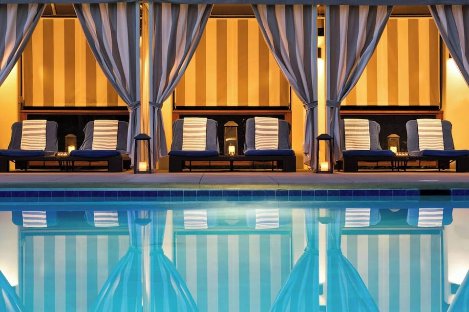 Unwind poolside under glowing cabanas and soft lantern light.