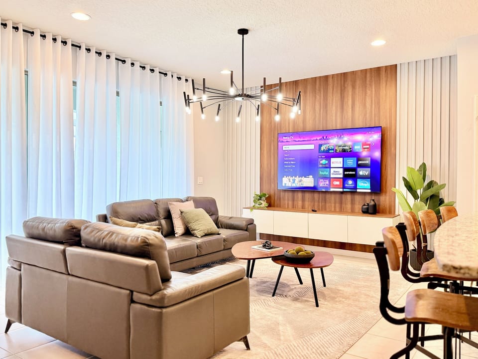 Unwind on the cozy leather couch and enjoy movies on the big-screen Smart TV.