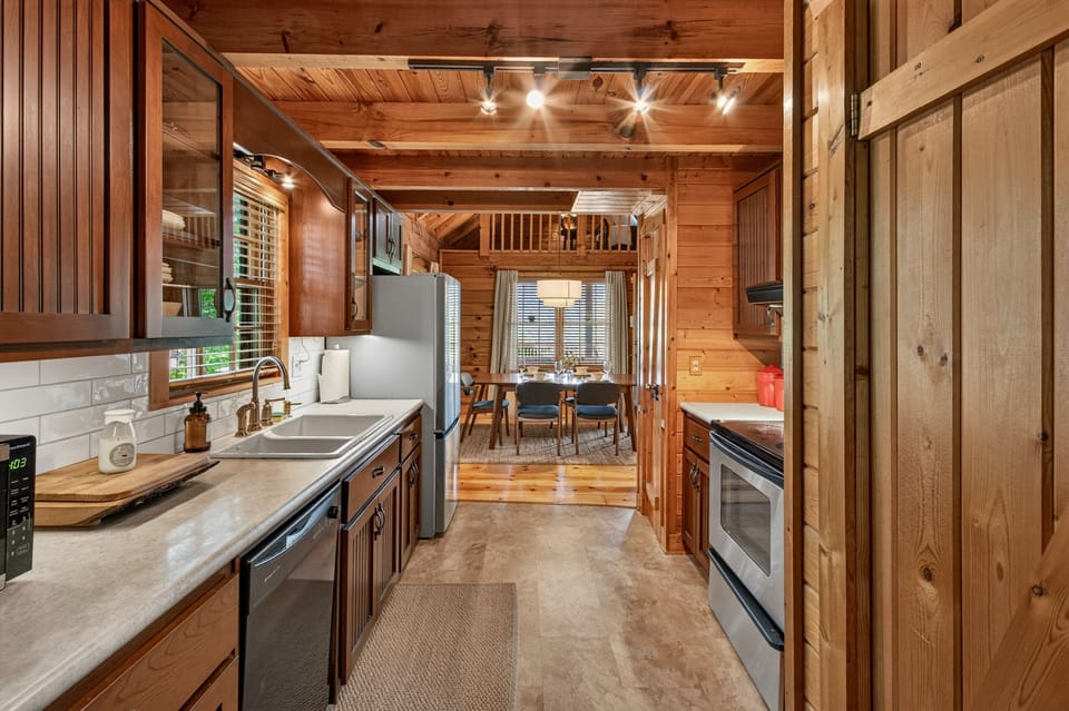 Cozy cabin kitchen with full appliances and open dining area