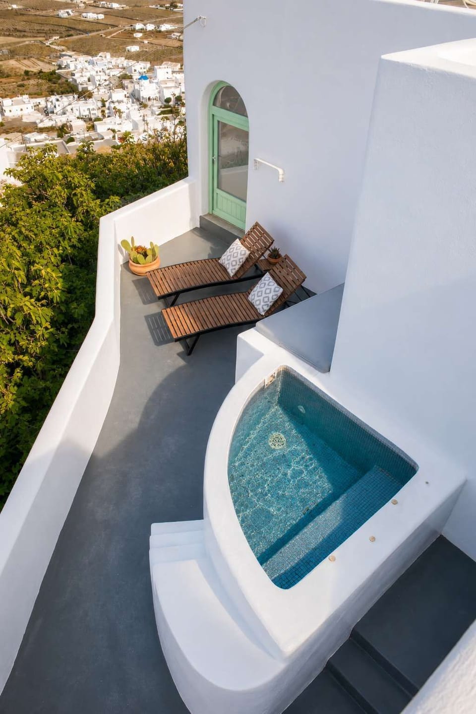 Relax in the private heated jacuzzi with sea and village views.