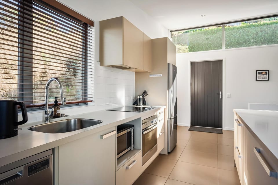 Fully stocked kitchen with quality cookware and coffee machine - ideal for family meals or entertaining.