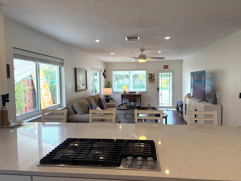 Bright open living space with kitchen island and cozy seating