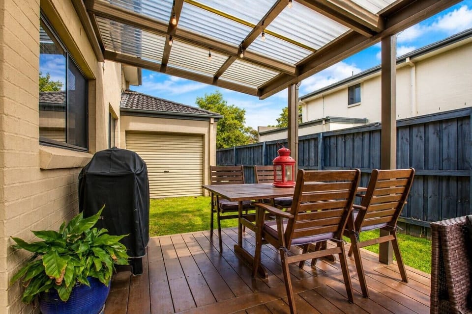 Relax on the covered patio with comfortable outdoor seating.