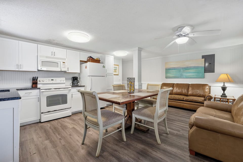 Full kitchen with dishwasher, stove, microwave and oven