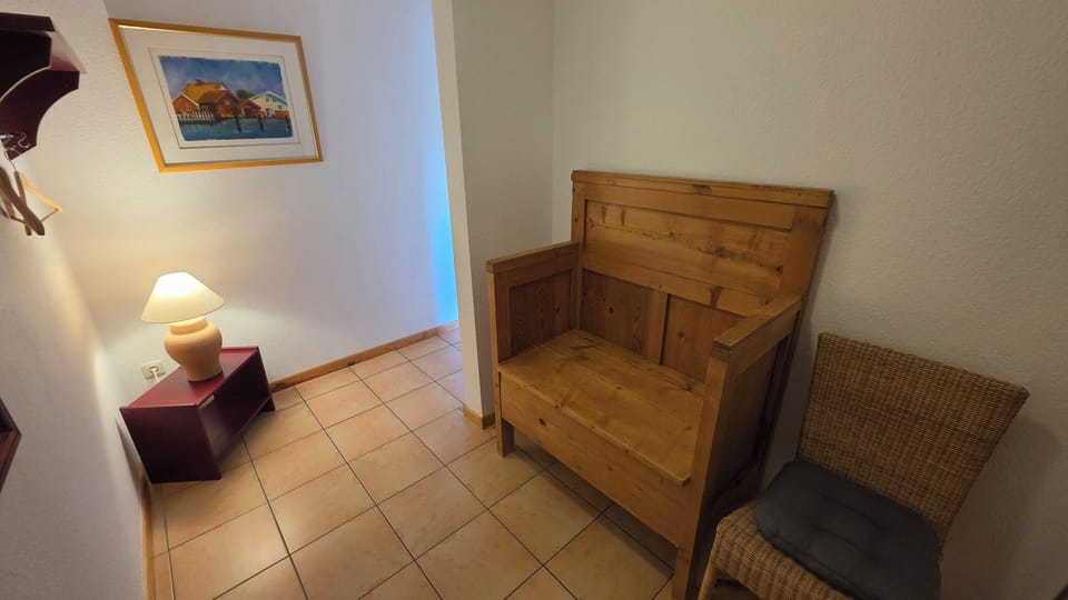 Entrance Area with Wooden Bench and Chair