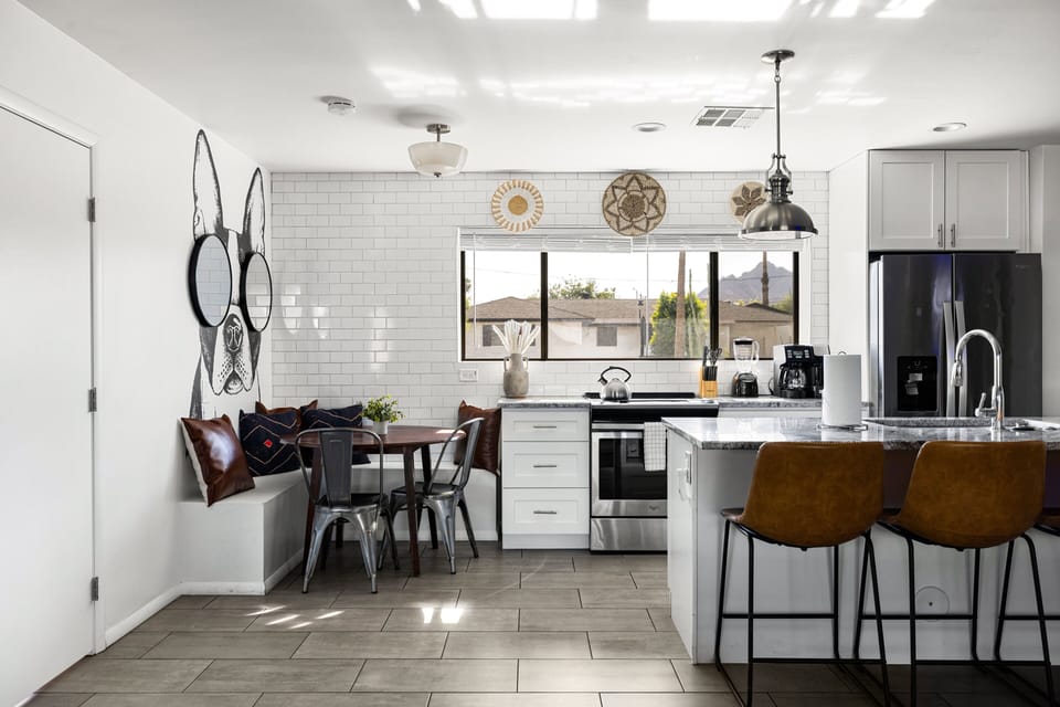 Enjoy a bright, open kitchen with bar seating and a cozy breakfast nook. The spacious layout makes cooking, dining, and gathering easy for your entire group.