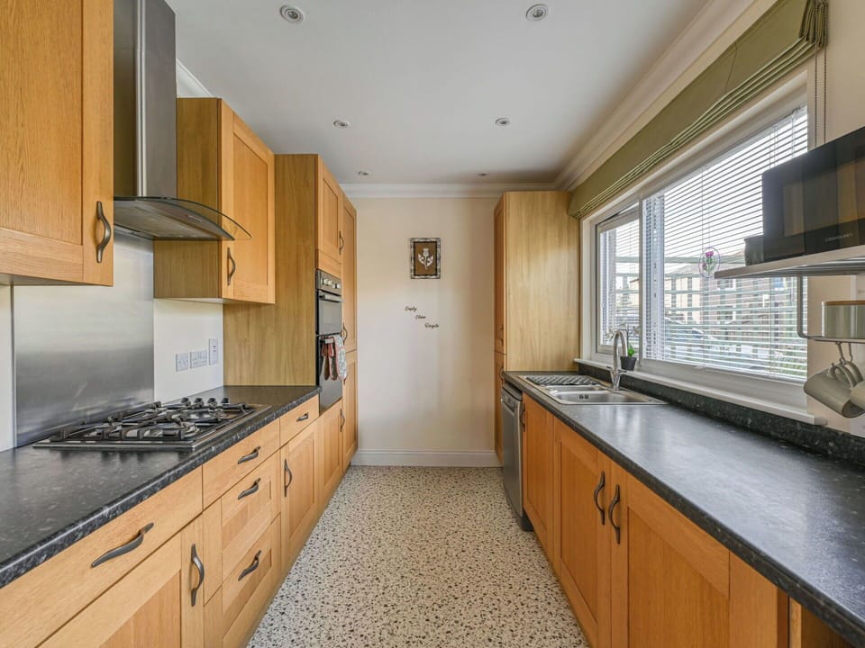 Kitchen, Countertop, Cabinetry, Flooring, Interior Design, Kitchen Appliance, Wood, Floor, Major Appliance, Ceiling