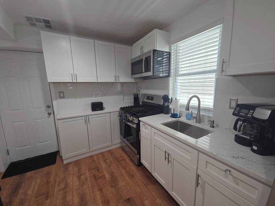 Bright modern kitchen with stainless appliances and ample cabinet space
