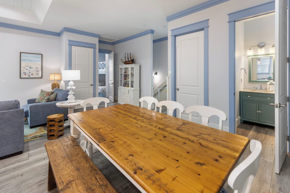 Gather around a beautiful farmhouse table, with plenty of seating for family meals and game nights, while staying connected to the cozy living area.