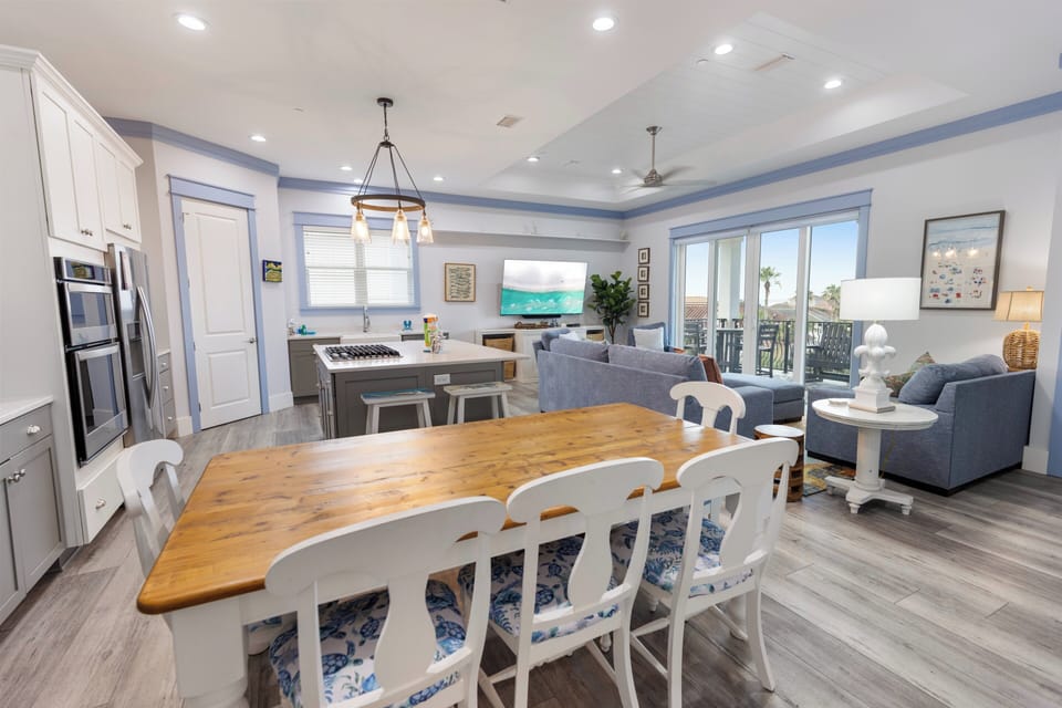 Gather around the live-edge dining table, cook in your bright kitchen, and relax in the living room—all in one open, airy space designed for your coastal getaway.