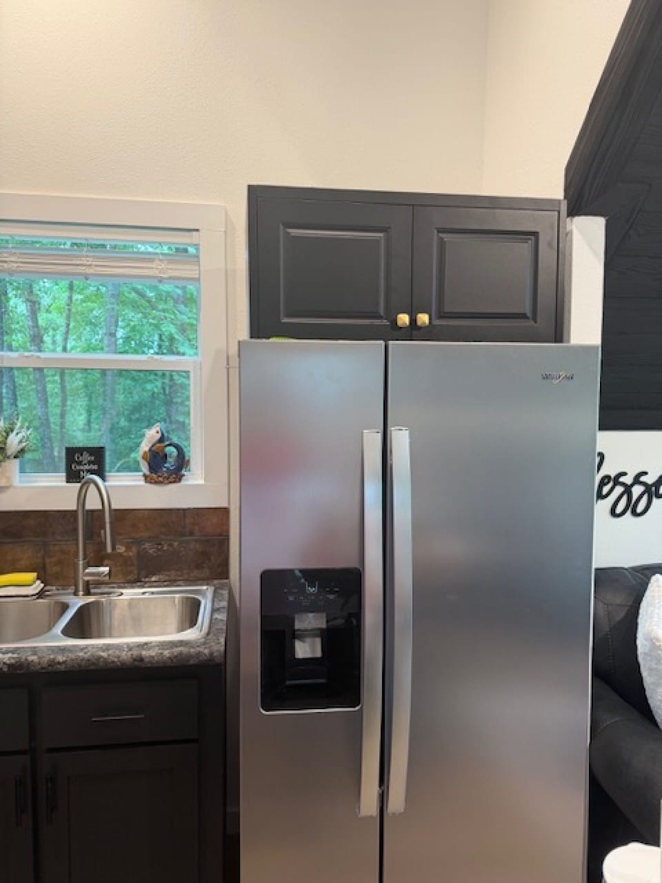 Full-size fridge in compact kitchen