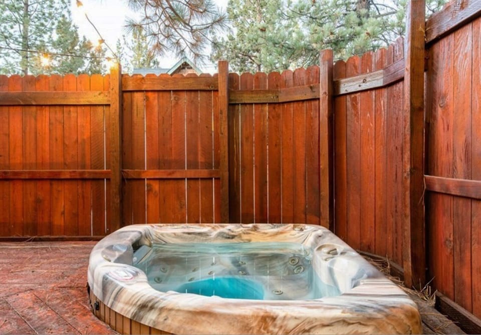 Private hot tub under the pines—soak and unwind.