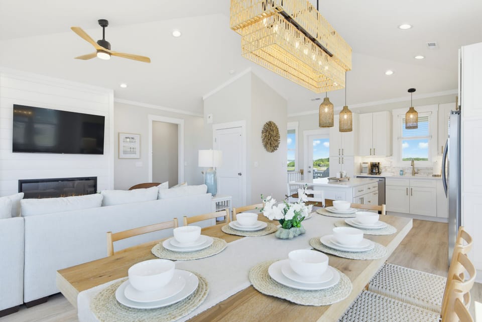 Dining area looking out the back windows and door to the sound & Intercoastal.