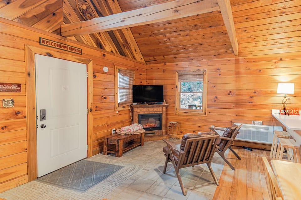 Living Area - Complete with two lounge chairs, an electric fire place, and smart tv. Stream your favorite shows and keep cozy!