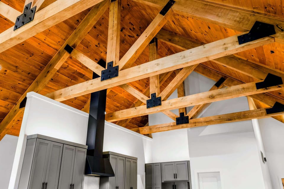 Great Room - Timber trusses with black steel plates, a detail worth looking up for.