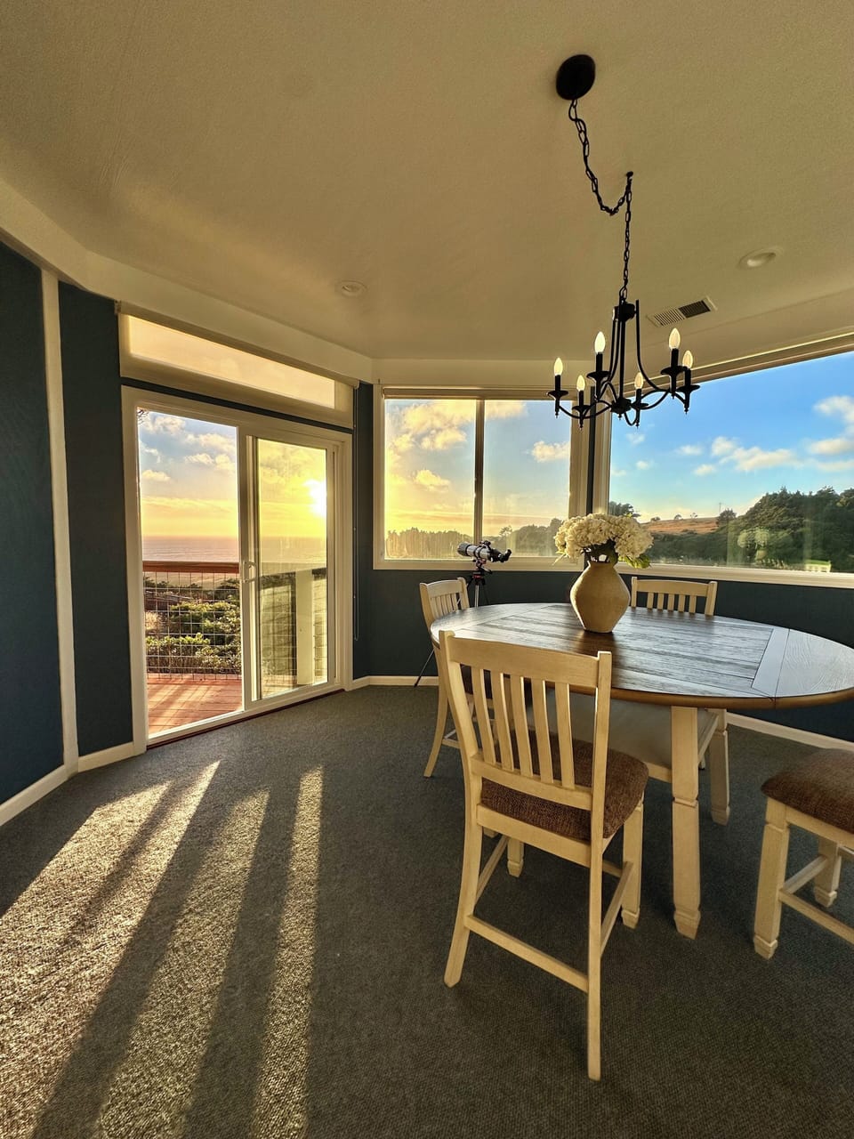 Sun room where you can enjoy watching the sunset over dinner.