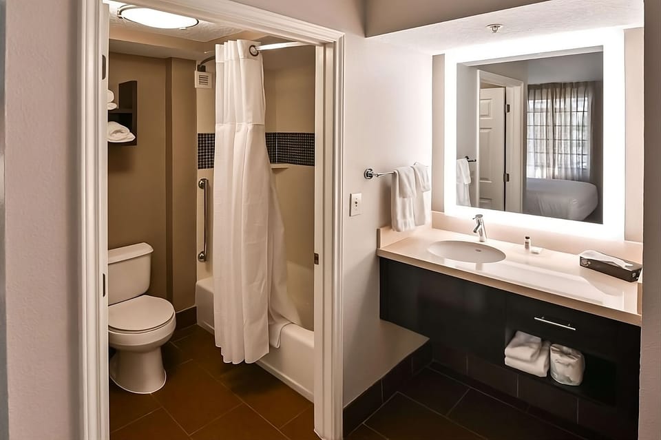 Freshen up in a clean, well-lit vanity area.