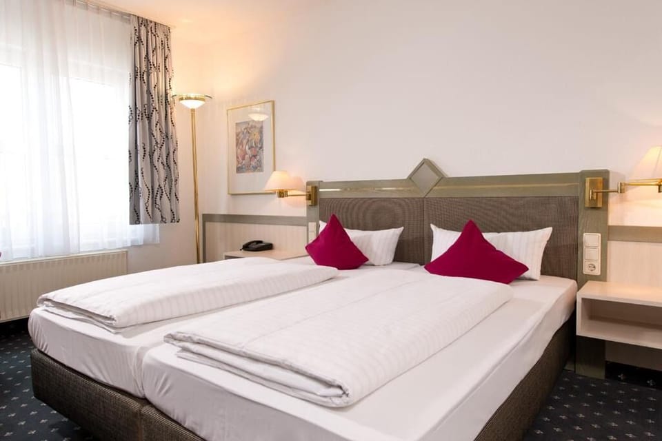 Drift off in crisp linens and soft bedside lighting.