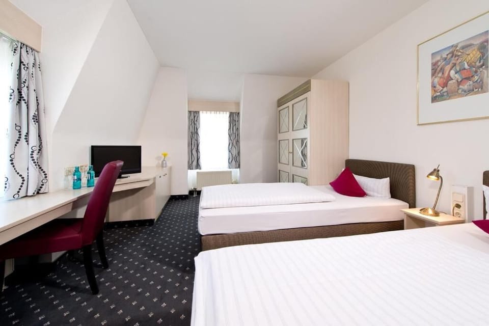 Settle in with roomy layout, desk nook, and twin beds.