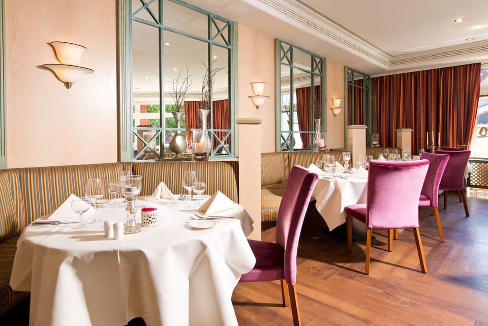 Dine comfortably with plush seating and thoughtful table settings.