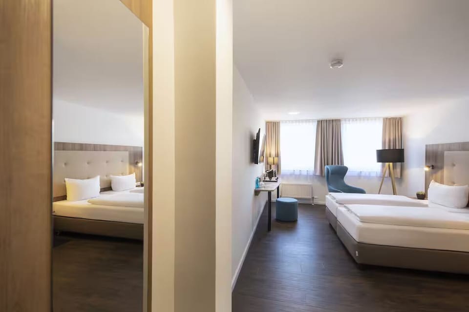 Stretch out in a spacious room with calm, modern comfort.