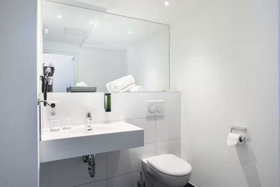 Refresh easily in a spotless bath with bright mirror lighting.