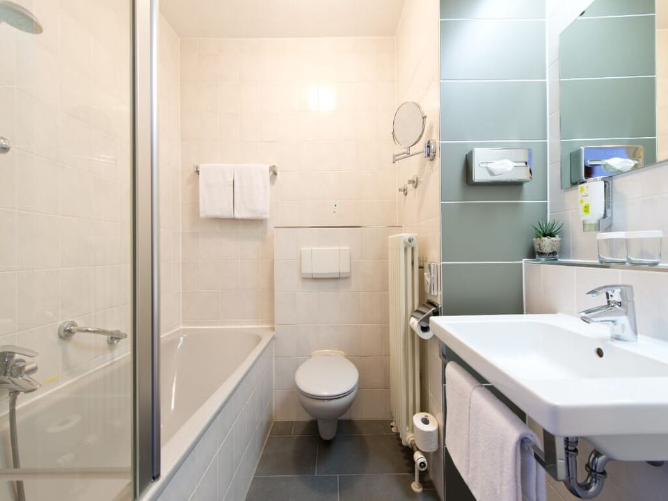 Soak and reset in a spotless bath with modern fixtures.