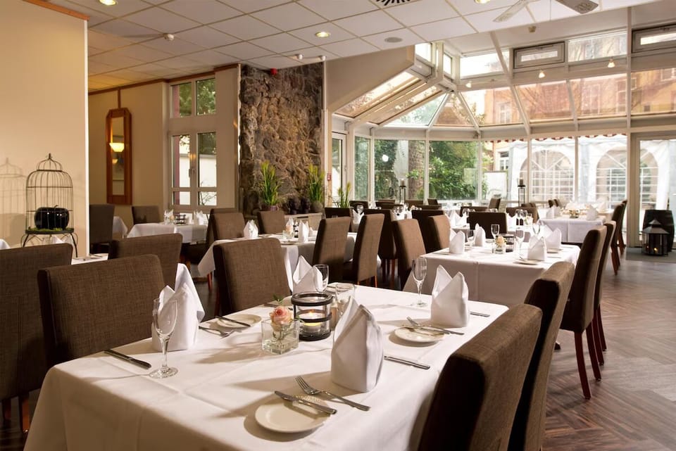 Celebrate long meals in a sunlit dining room setting.