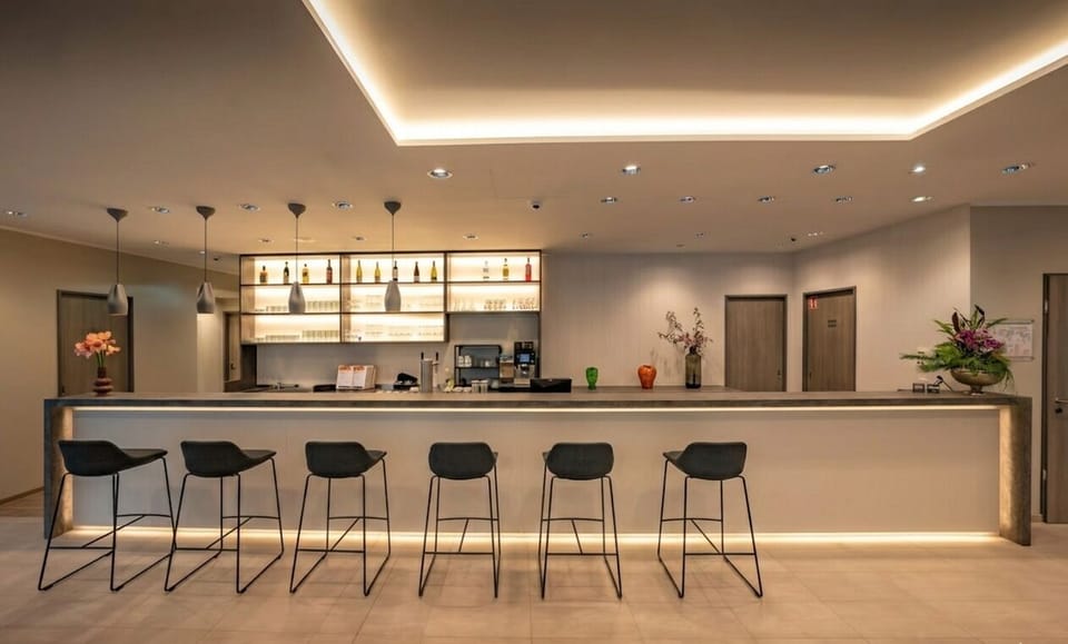 Toast the evening at an elegant, softly lit lounge bar.