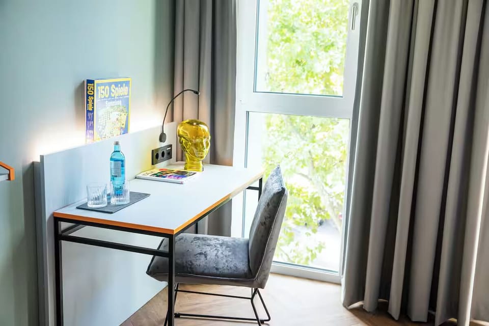 Plan your day by the window at a bright writing desk.