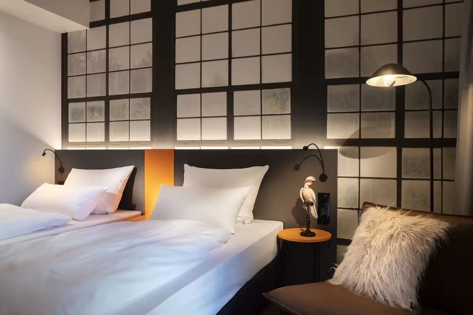 Sink into comfort with warm bedside lighting and plush seating.