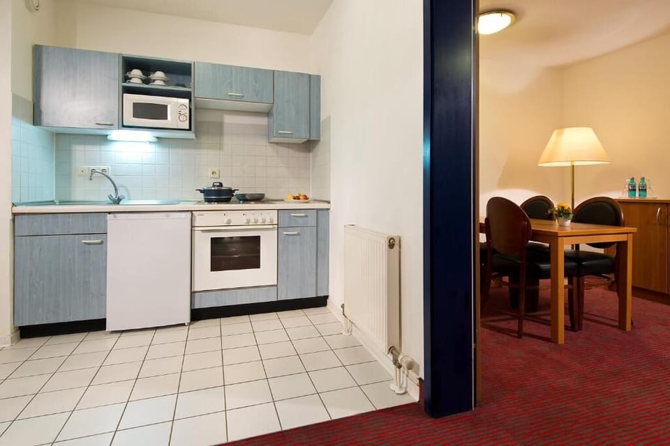 Cook simple meals comfortably with an equipped, practical kitchen.