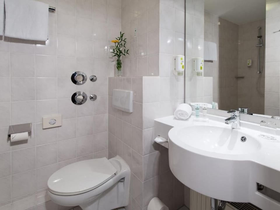 Refresh in a spotless bathroom with spacious sink and shower.