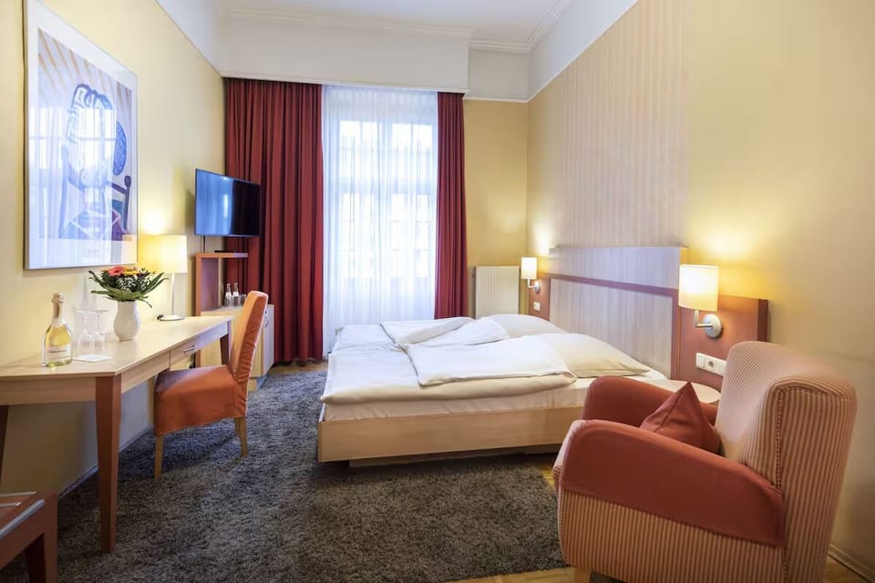 Settle into cozy elegance with soft light and quiet comfort.