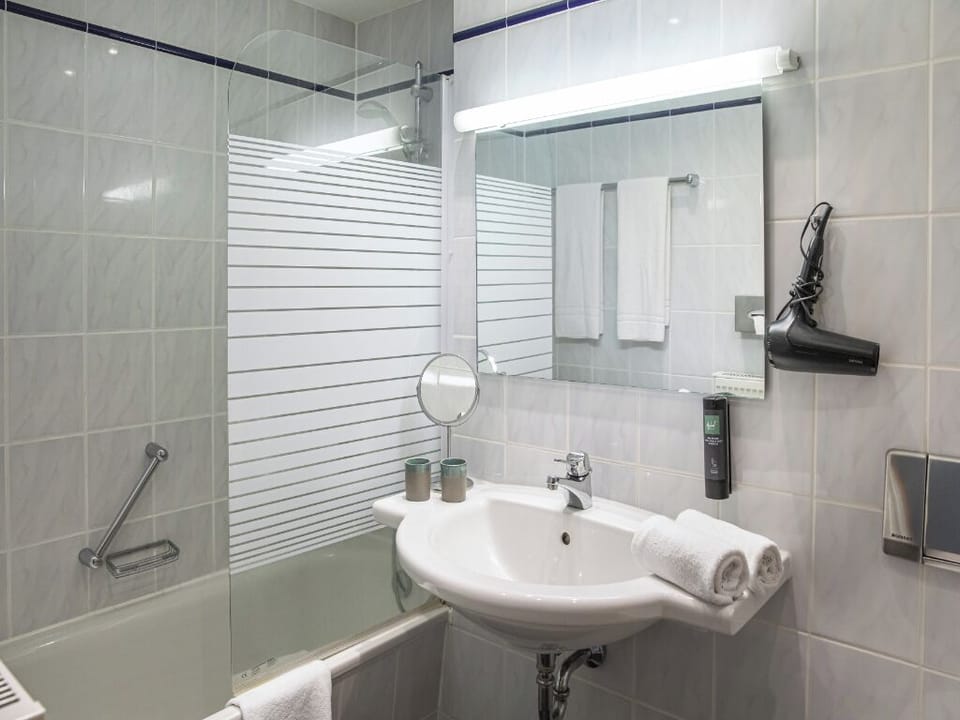 Refresh with a bright vanity and spotless tub-shower combo.