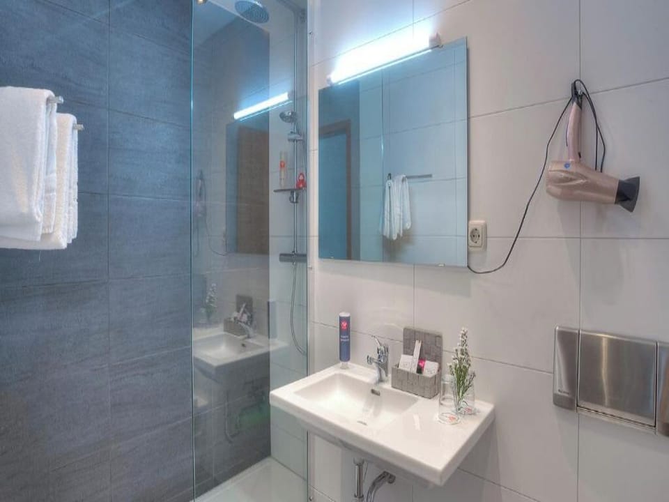Start the day fresh in a sleek, modern walk-in shower.