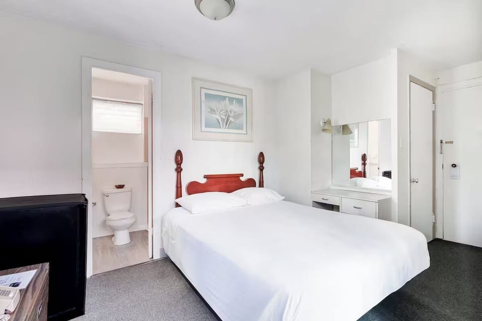 Get ready with ease at the vanity beside your restful bed.