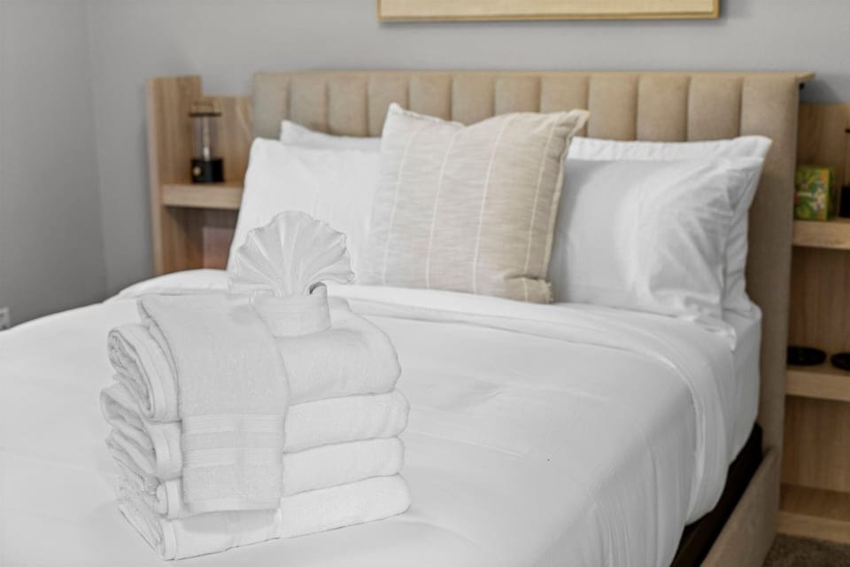 Sink into crisp linens and plush pillows after a day of exploring Arlington, creating the perfect place to relax and recharge.