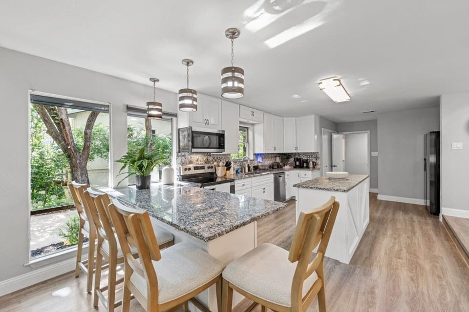Cook, connect, and create memories in the fully updated kitchen with generous counter space and seating for family and friends.