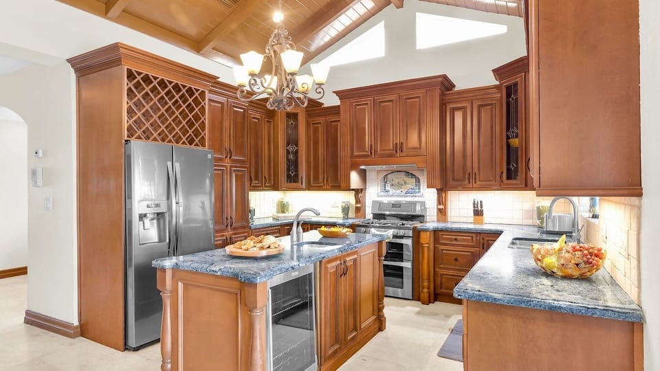 Featuring stainless steel appliances and expansive granite countertops...