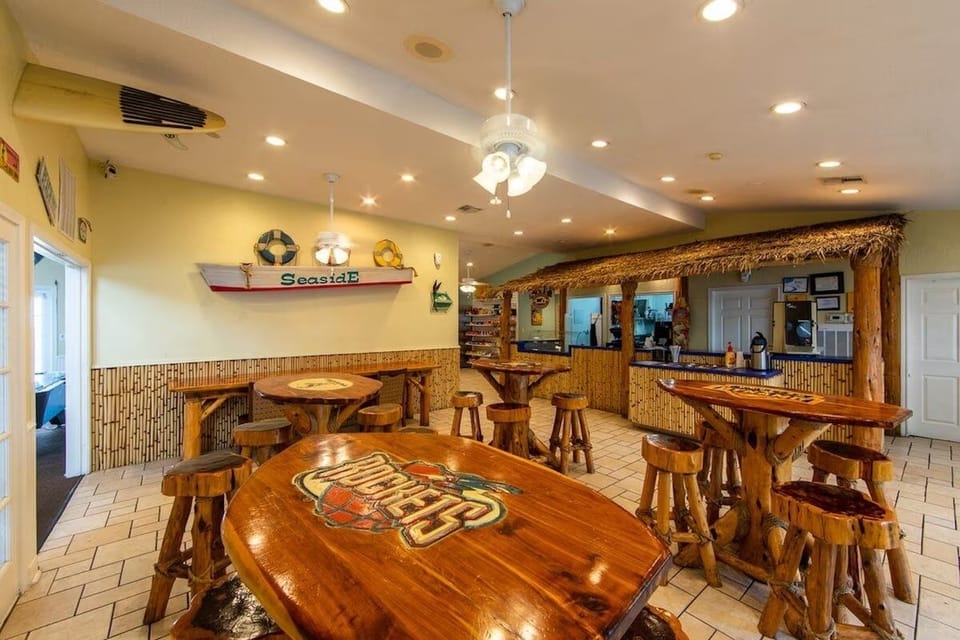 Sip tropical drinks and laugh together in lively beach bar.