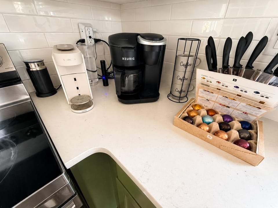 Coffee bar stocked with Nespresso, Keurig, and pods for the perfect brew.